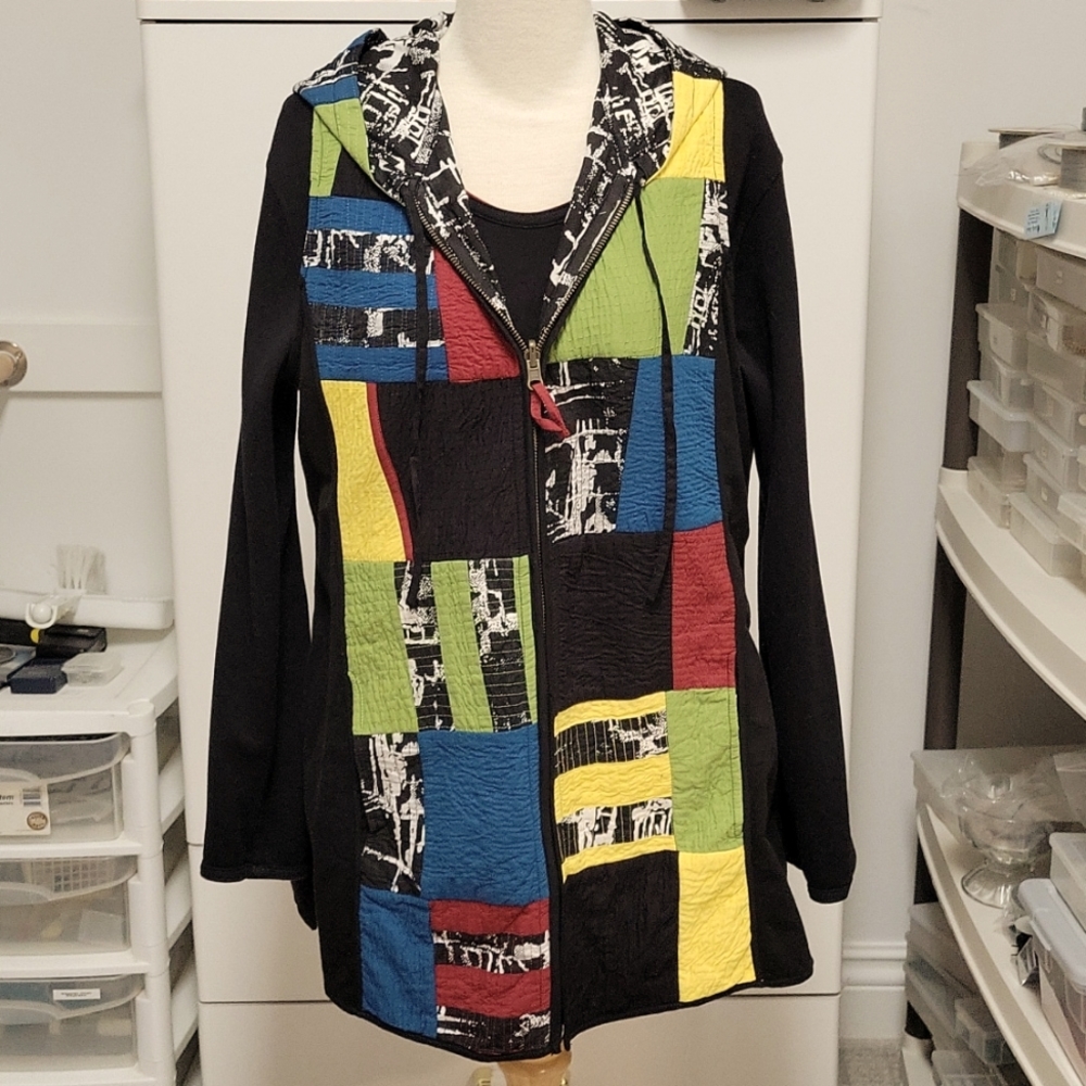 Reversible vest with hood